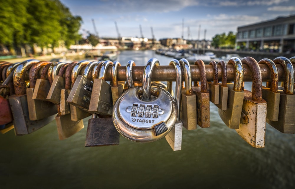 a bunch of padlocks are attached to a bridge