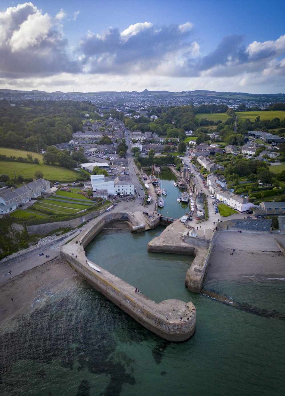 an aerial view of a harbor and a city