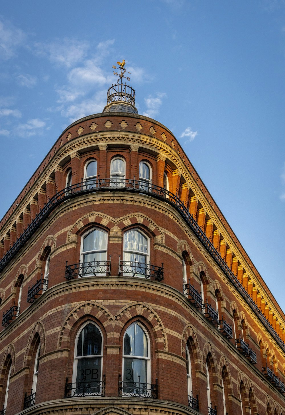 a tall brick building with lots of windows