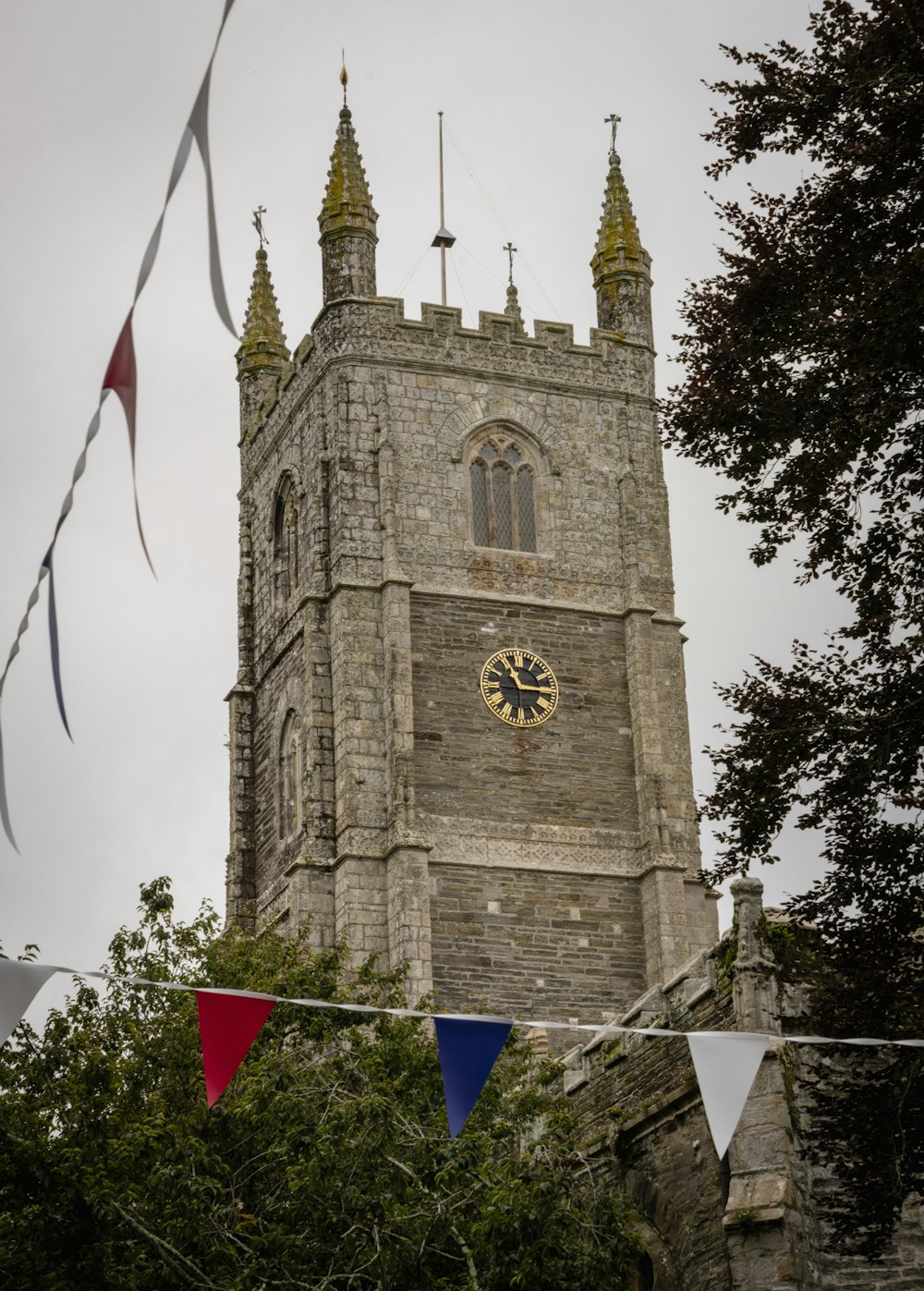 a tall tower with a clock on the side of it