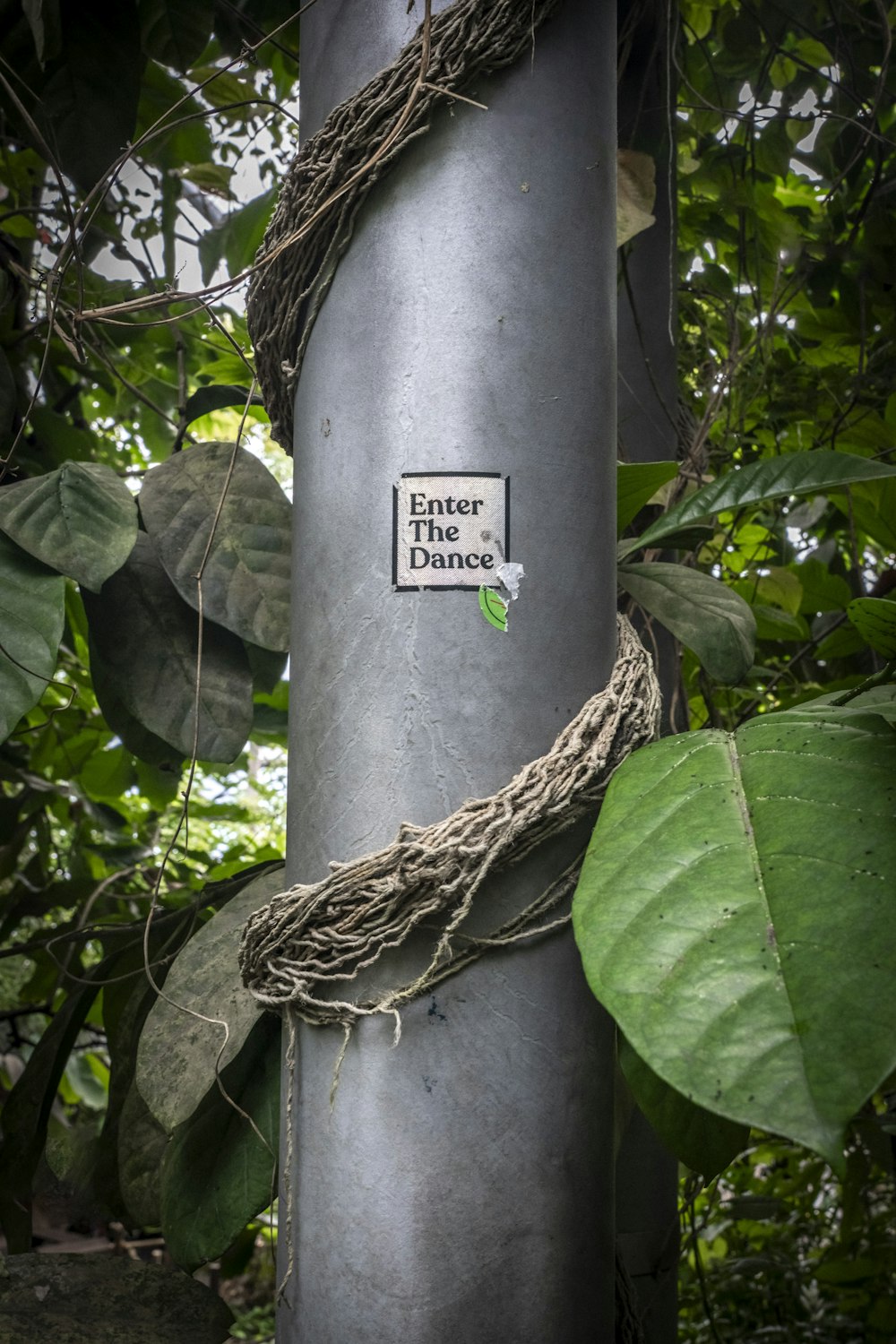 a metal pole with a sticker on it