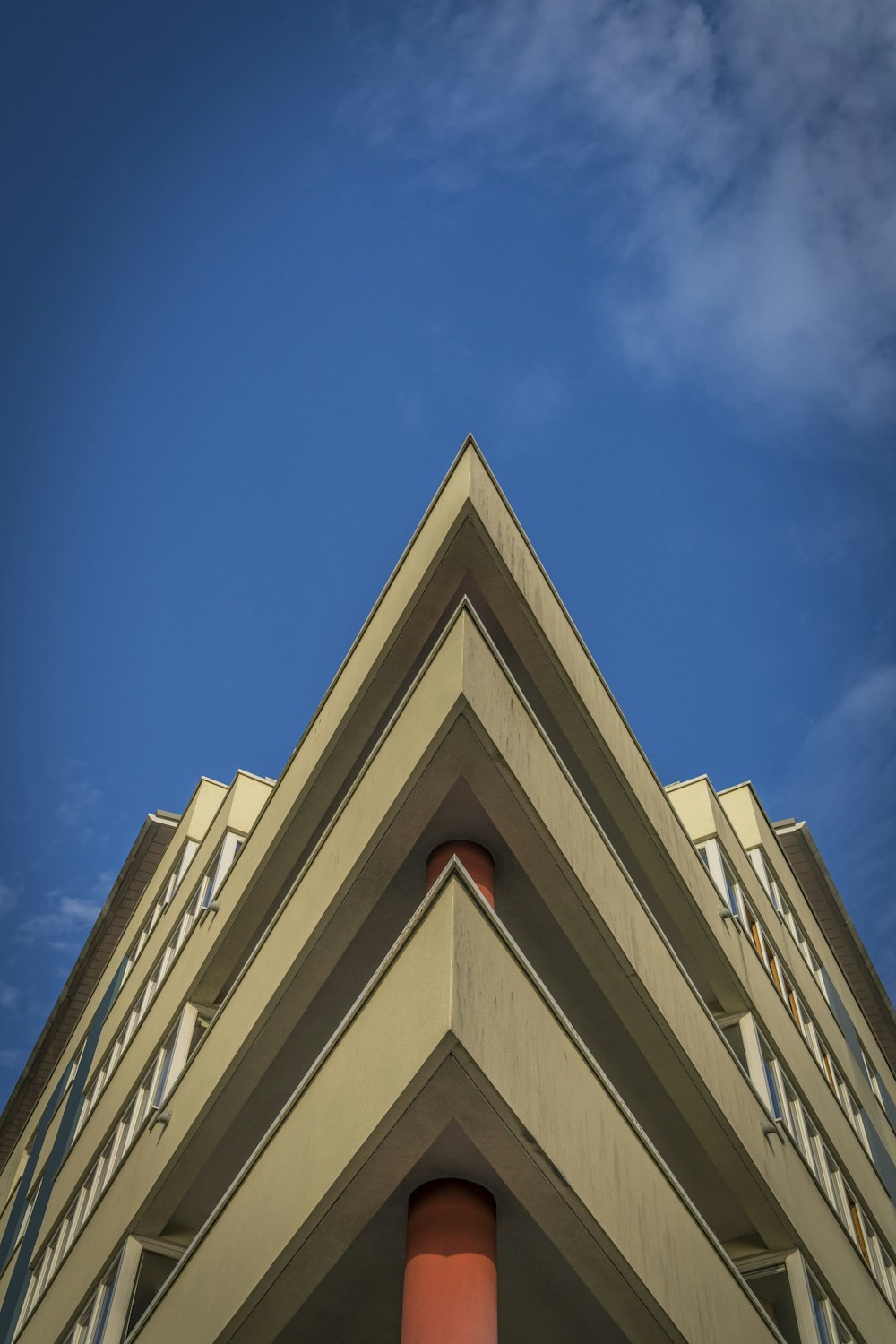 a tall building with a sky in the background