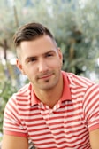 a man in a red and white striped shirt