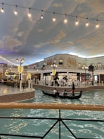 Warm interior of La Gondola with colorful walls and rustic wooden tables.