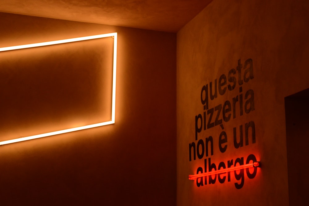 a room with a neon sign on the wall