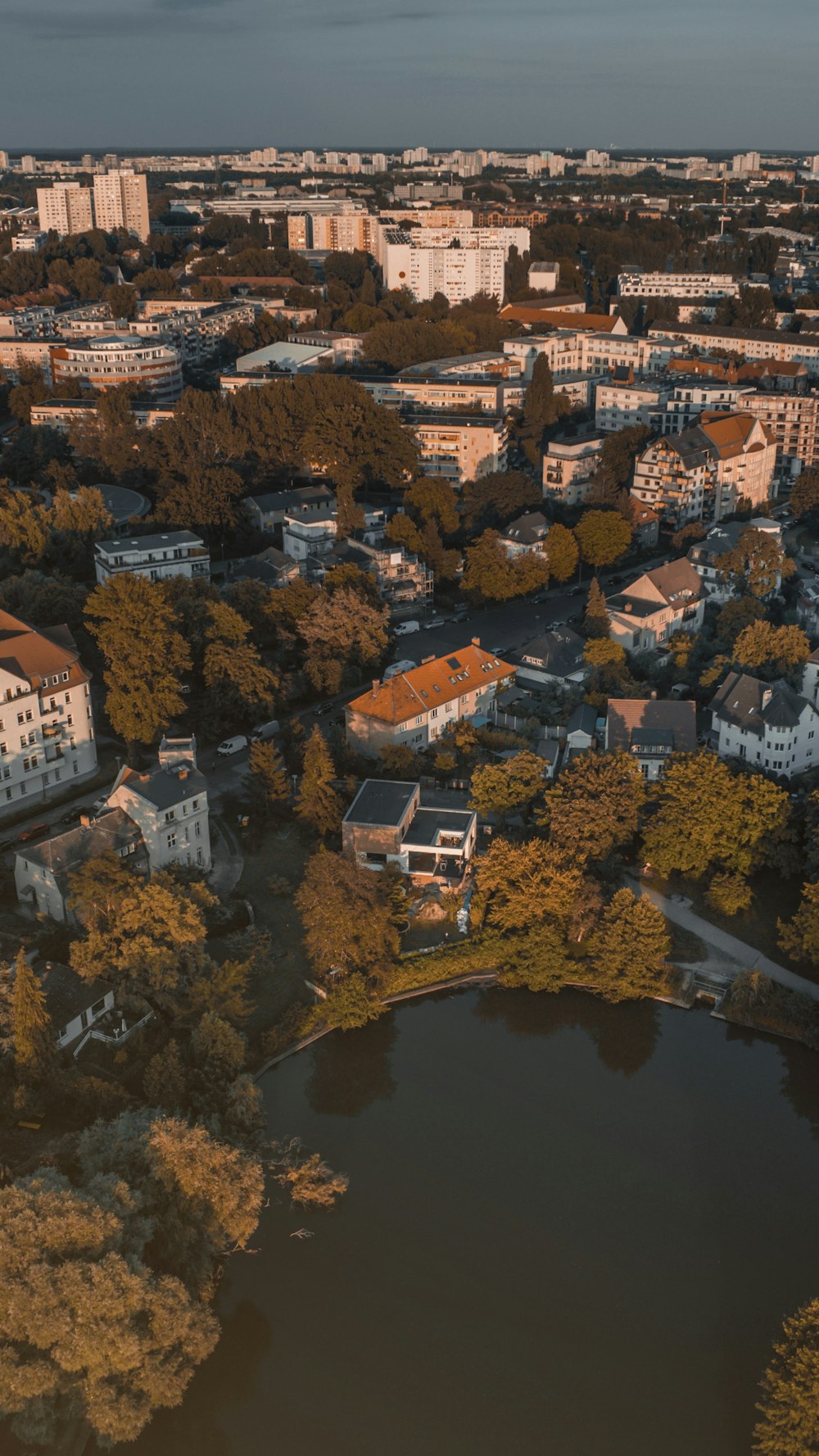 an aerial view of a city and a lake