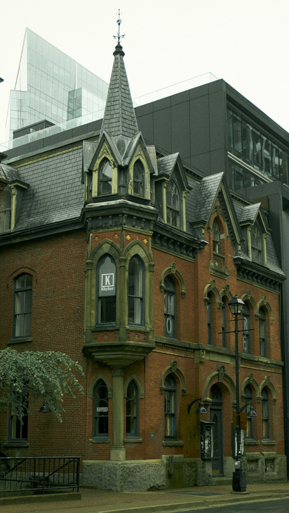 a large red brick building with a clock tower