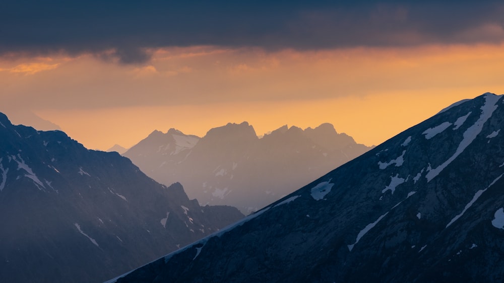 a view of a mountain range at sunset