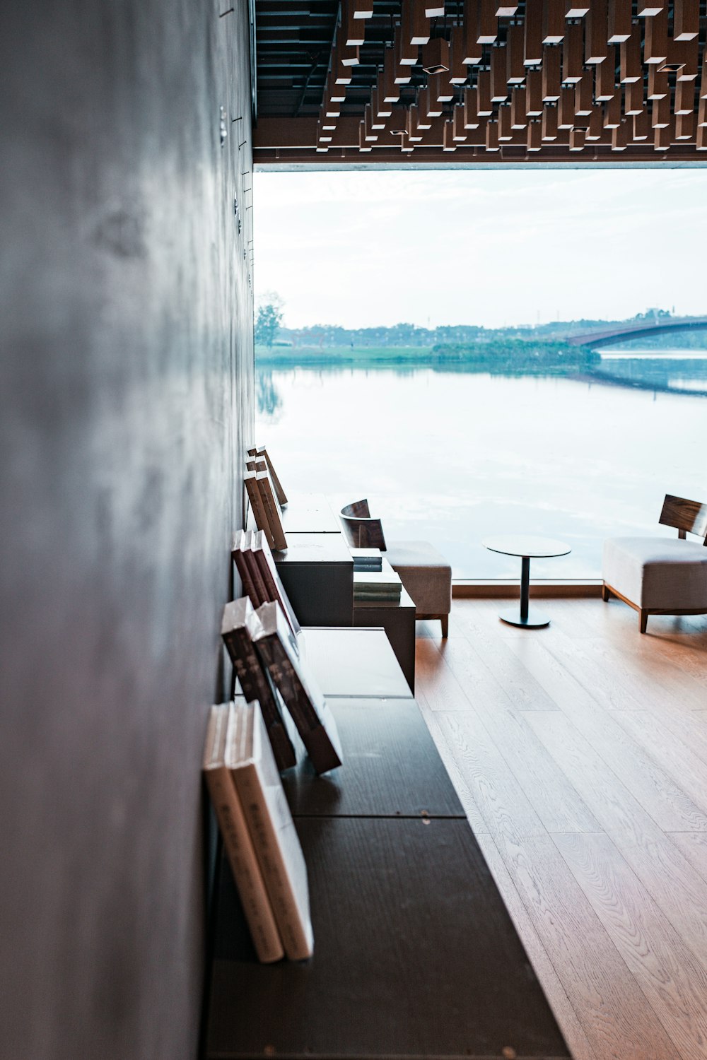 a row of benches sitting on top of a wooden floor