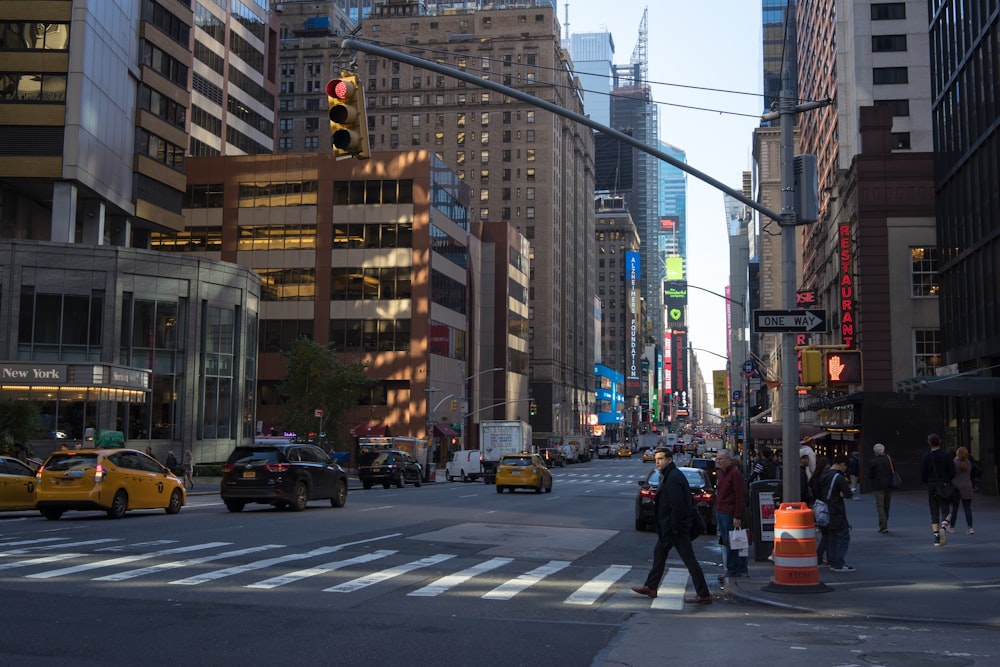 a city street filled with traffic and tall buildings