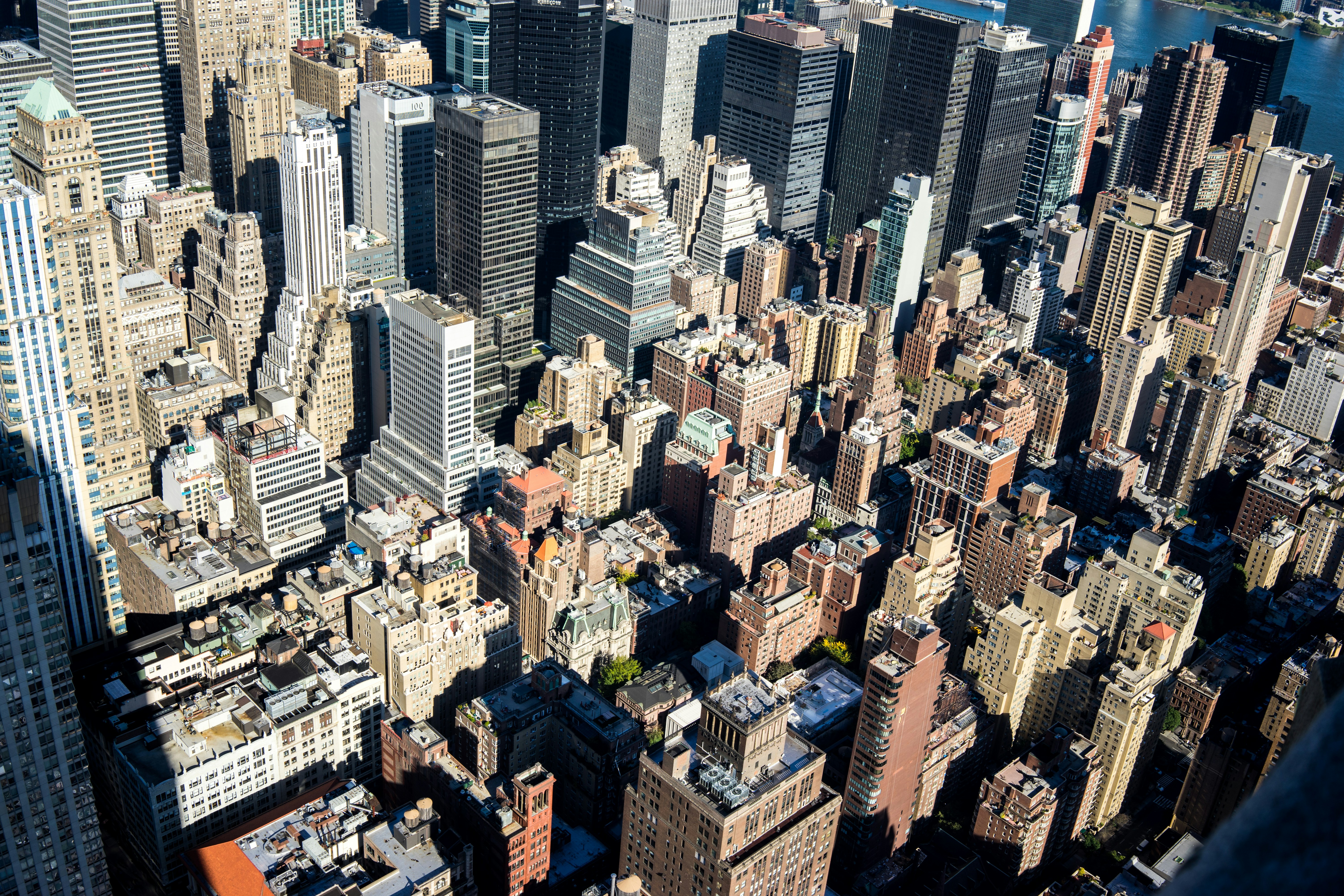 an aerial view of a city with tall buildings