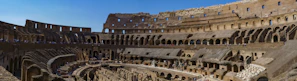 A sunlit view of Verona's ancient Arena filled with visitors.
