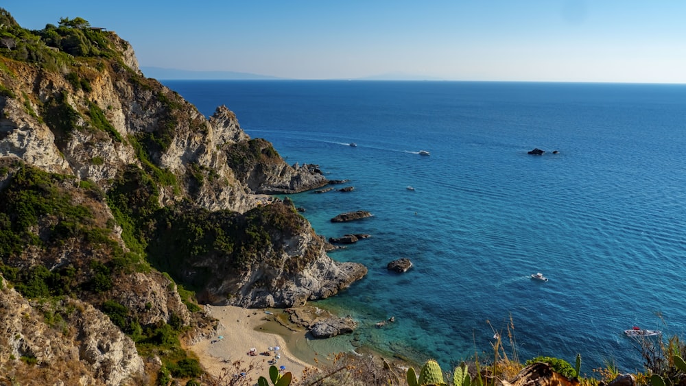 a view of a beach with boats in the water