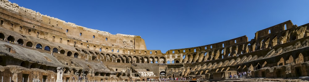 the interior of a large building with a sky background