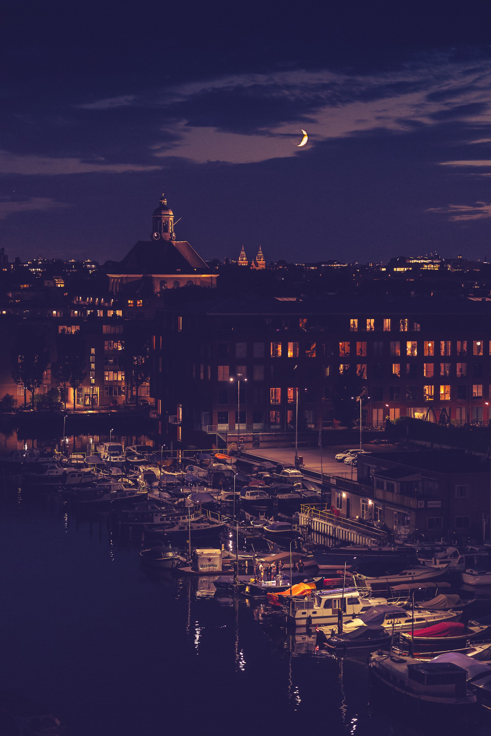 a harbor filled with lots of boats at night
