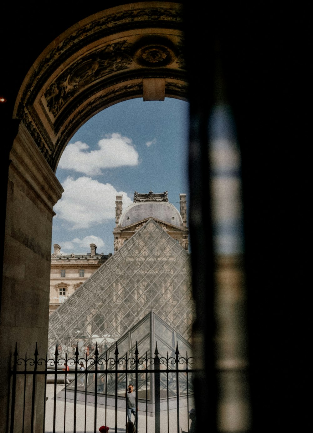 a view of a pyramid through a gate