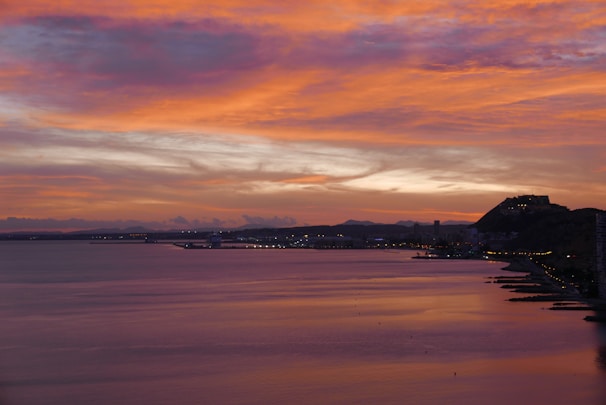 A picturesque view of the Costa Blanca coastline during sunset.