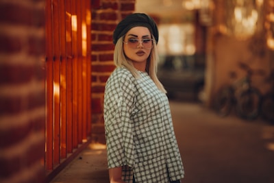 Candid shot of a stylish wanderer crossing a graffiti-lined alley, bathed in warm retro light.
