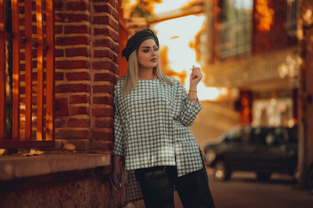 a woman smoking a cigarette on a city street