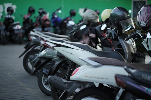 Rows of mobility scooters lined up neatly, showcasing the variety of models available for every need.