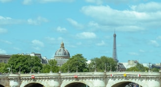 A picturesque view of the Seine River with Parisian landmarks.