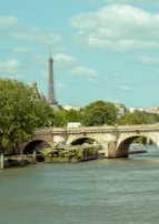A peaceful view of the Faidherbe Bridge stretching across the river.