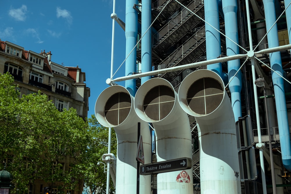 a group of pipes are attached to a building