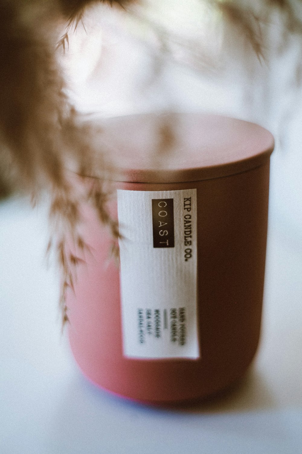 a close up of a pink container with a label on it