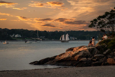 Sunset view of Ilhabela coastline with boats ready for diving excursions.