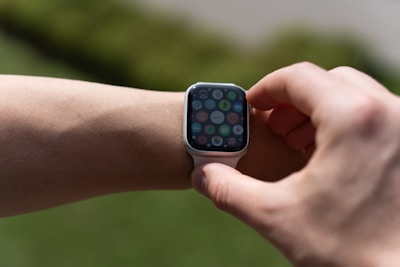 A close-up of a smart wearable device displaying notifications on its screen.