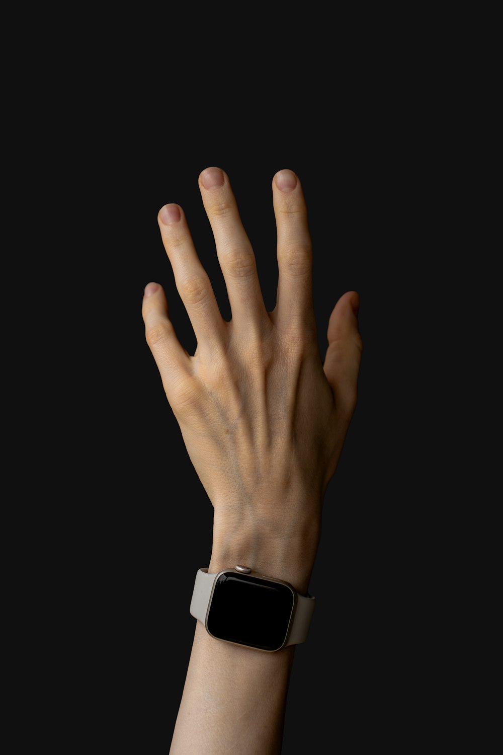 a person's hand with an apple watch on it
