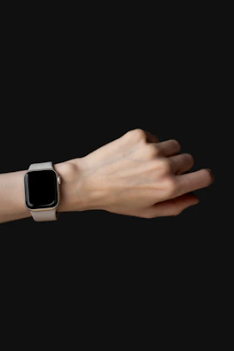 Smartwatch displaying notifications on a wrist against a dark background.