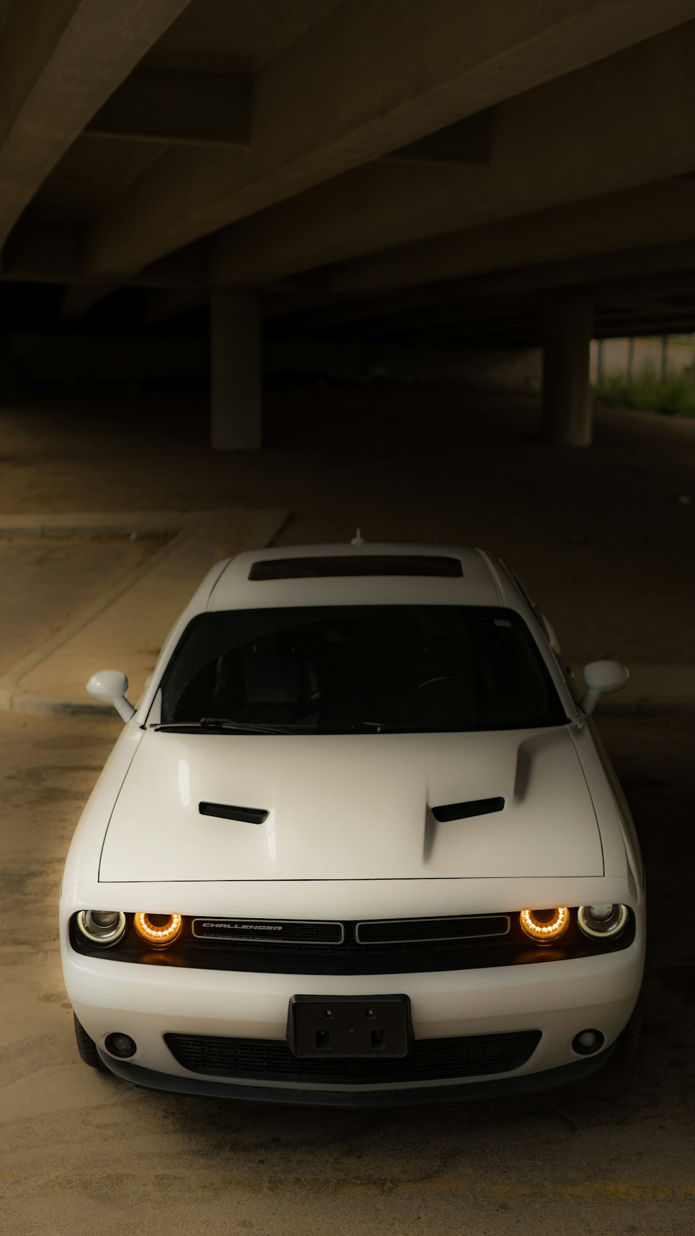 a white car parked in a parking garage