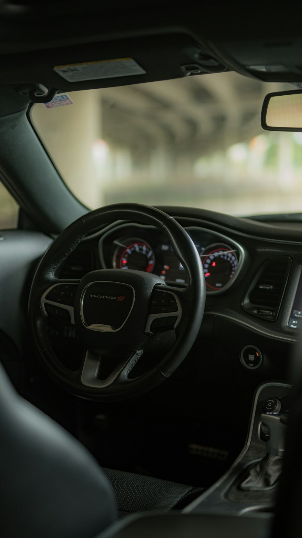 the interior of a car with a dash board and steering wheel