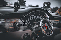 Interior car parts including dashboards and speedometers in great condition.
