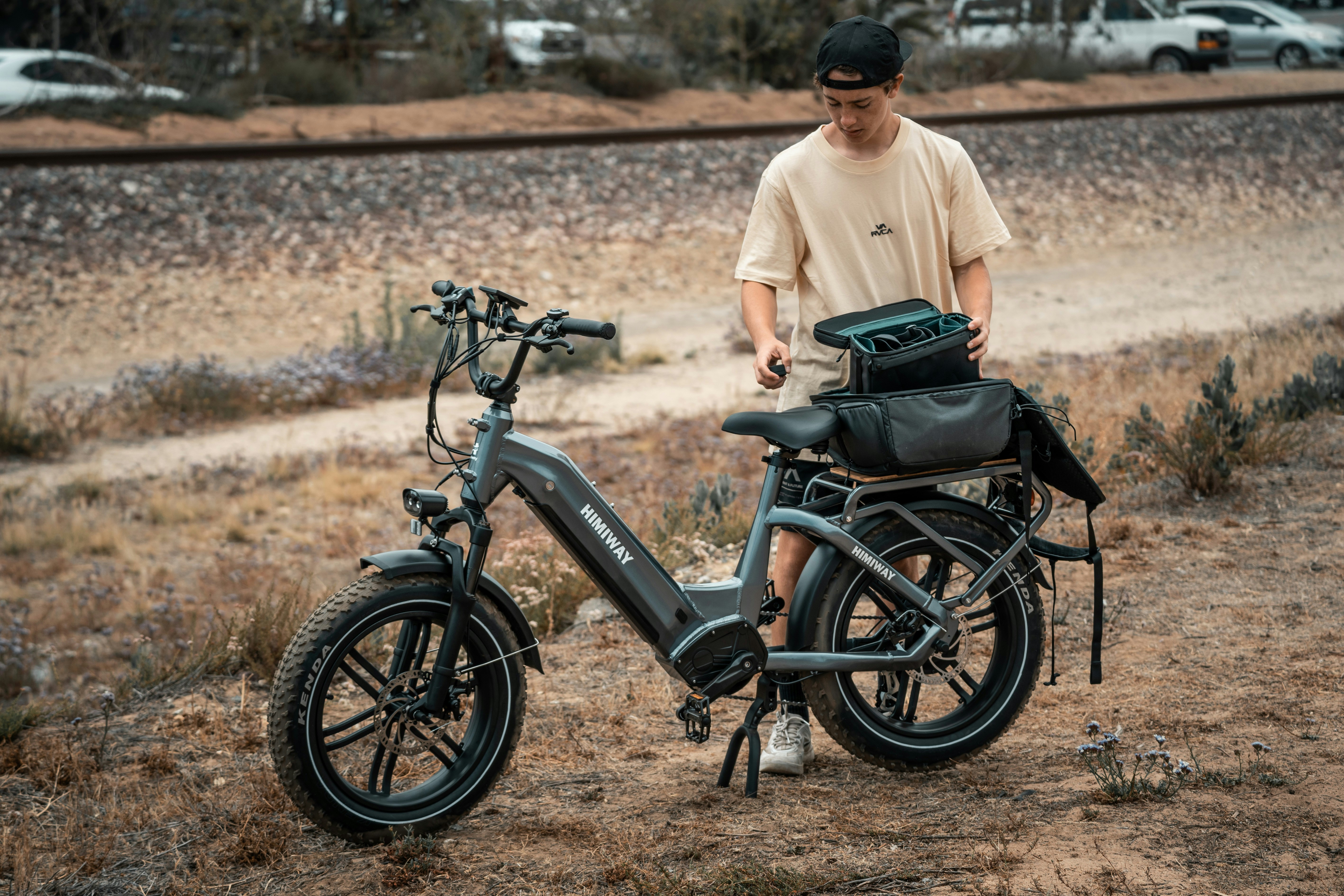 a man standing next to a parked bike