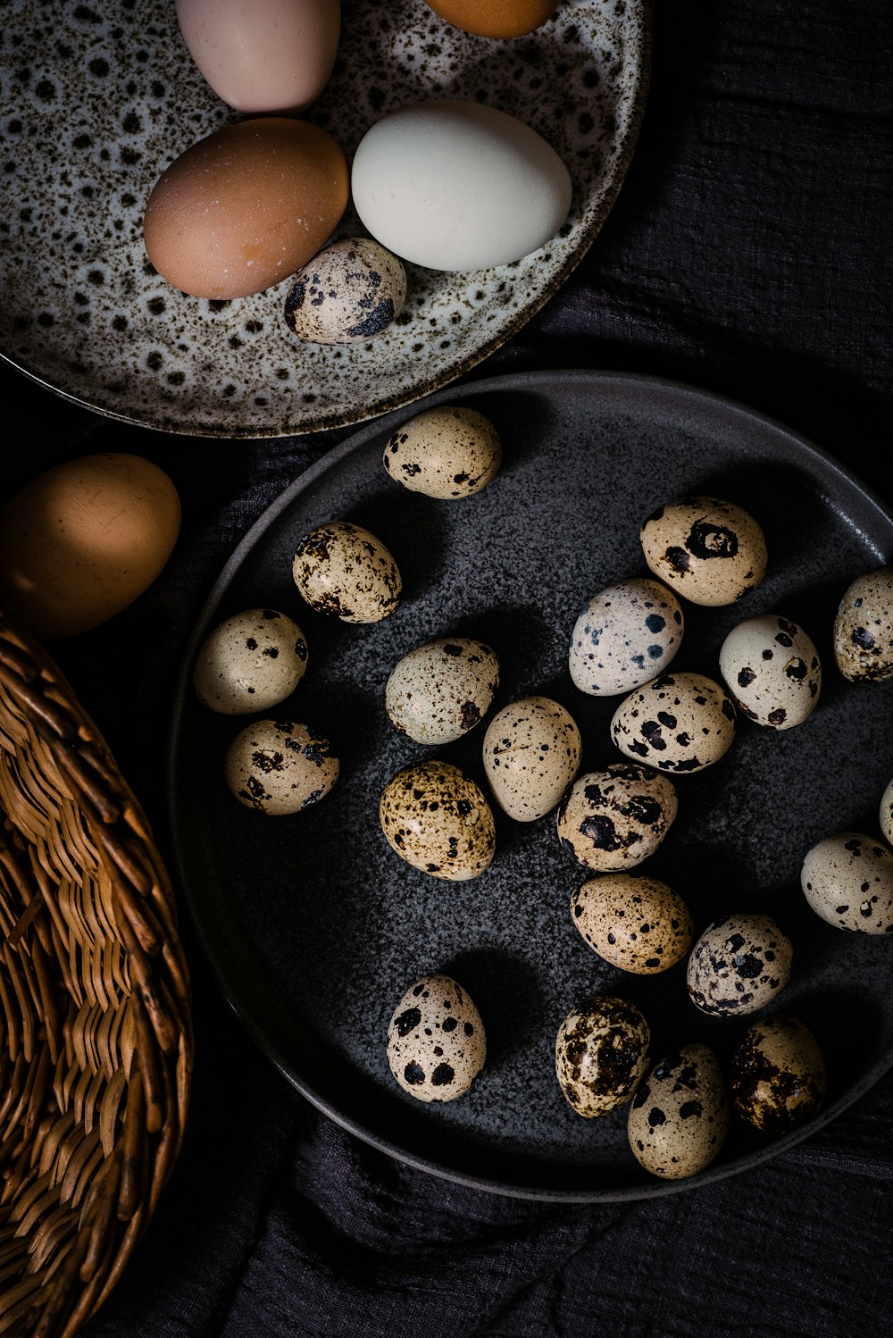 a plate of quails and eggs on a table
