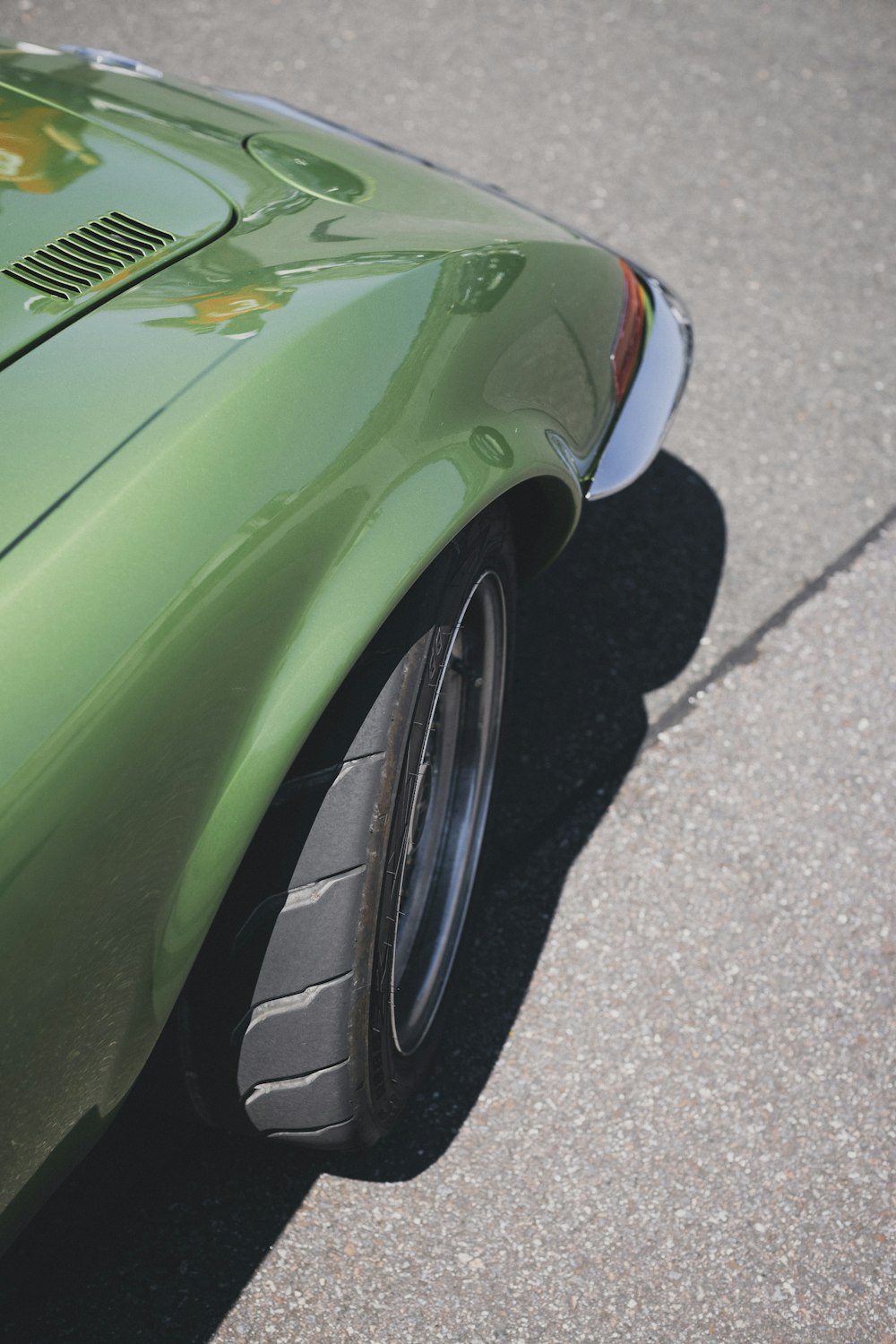 a close up of a green sports car