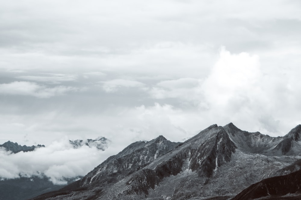 a black and white photo of a mountain range