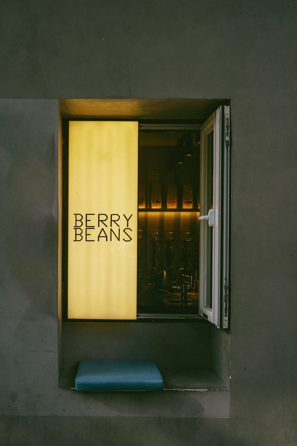 a window with the words berry beans written on it