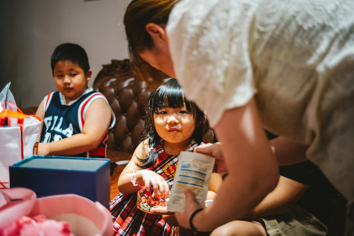 a group of children sitting around a table