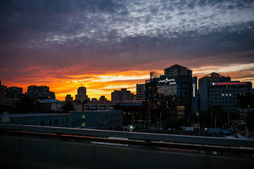 Medan cityscape with modern office buildings at sunset.