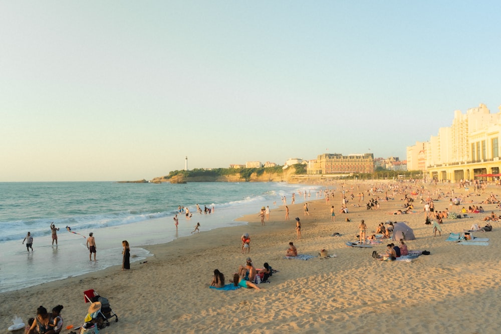 a crowded beach with many people on it