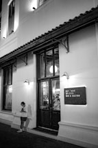 A welcoming image of the bistro's exterior with a contact sign.