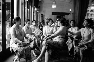 a group of women sitting next to each other