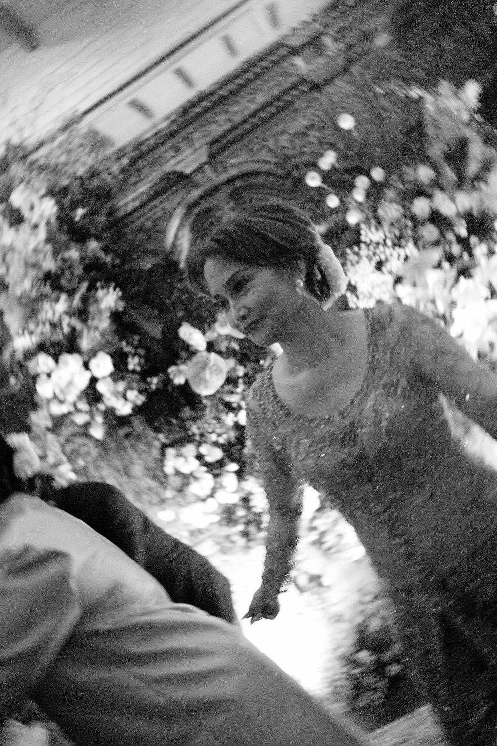 a black and white photo of a woman in a dress