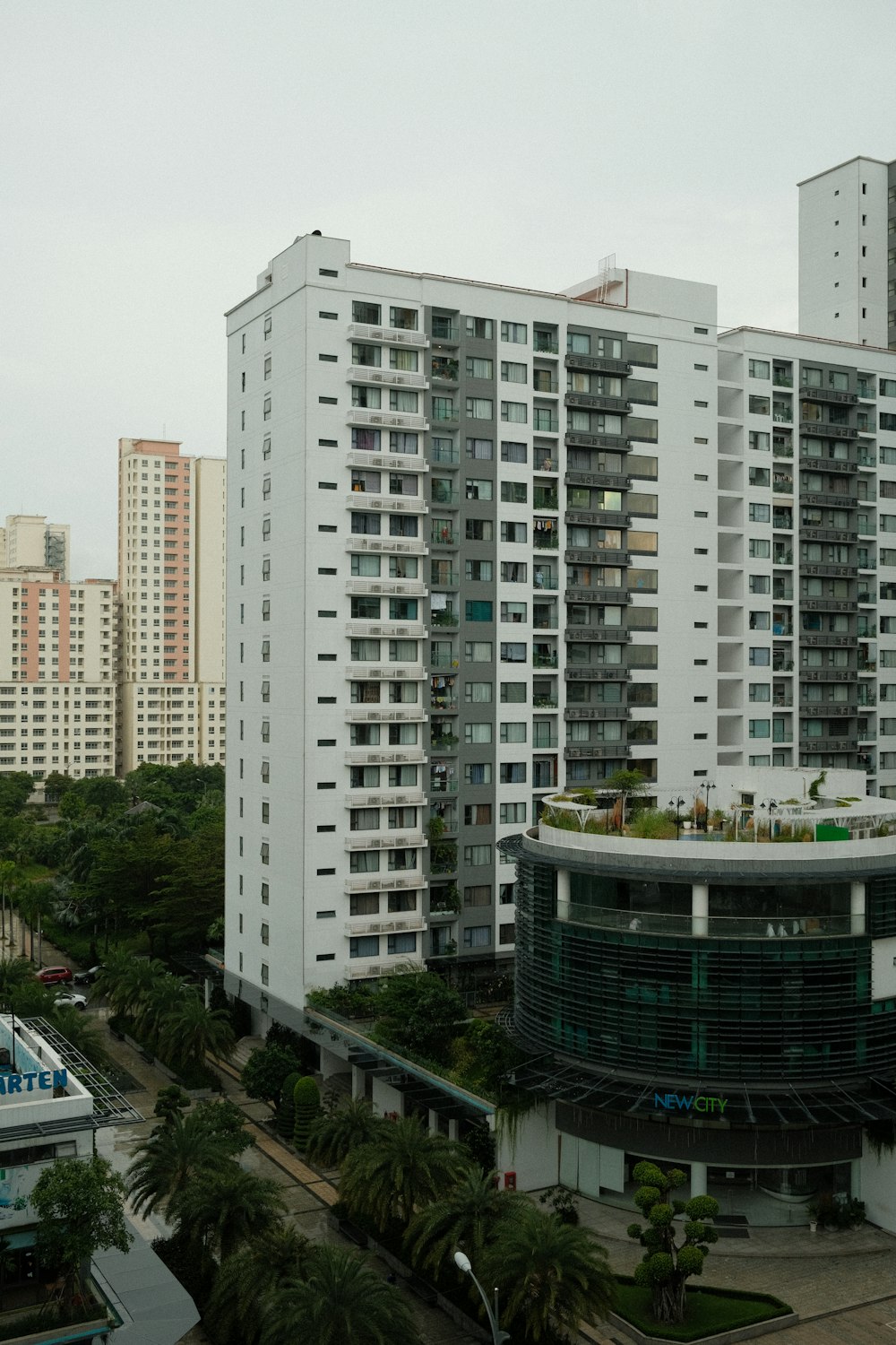 a very tall white building with a lot of windows