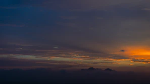 A wall art print made from a customer’s travel snapshot, capturing a sunset over mountains