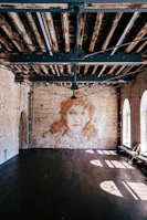 Spacious main room showcasing polished floors and inviting spaces for gatherings.