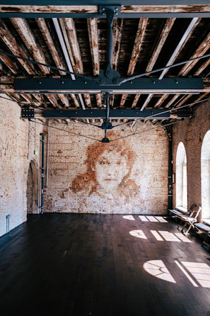 Spacious main room showcasing polished floors and inviting spaces for gatherings.